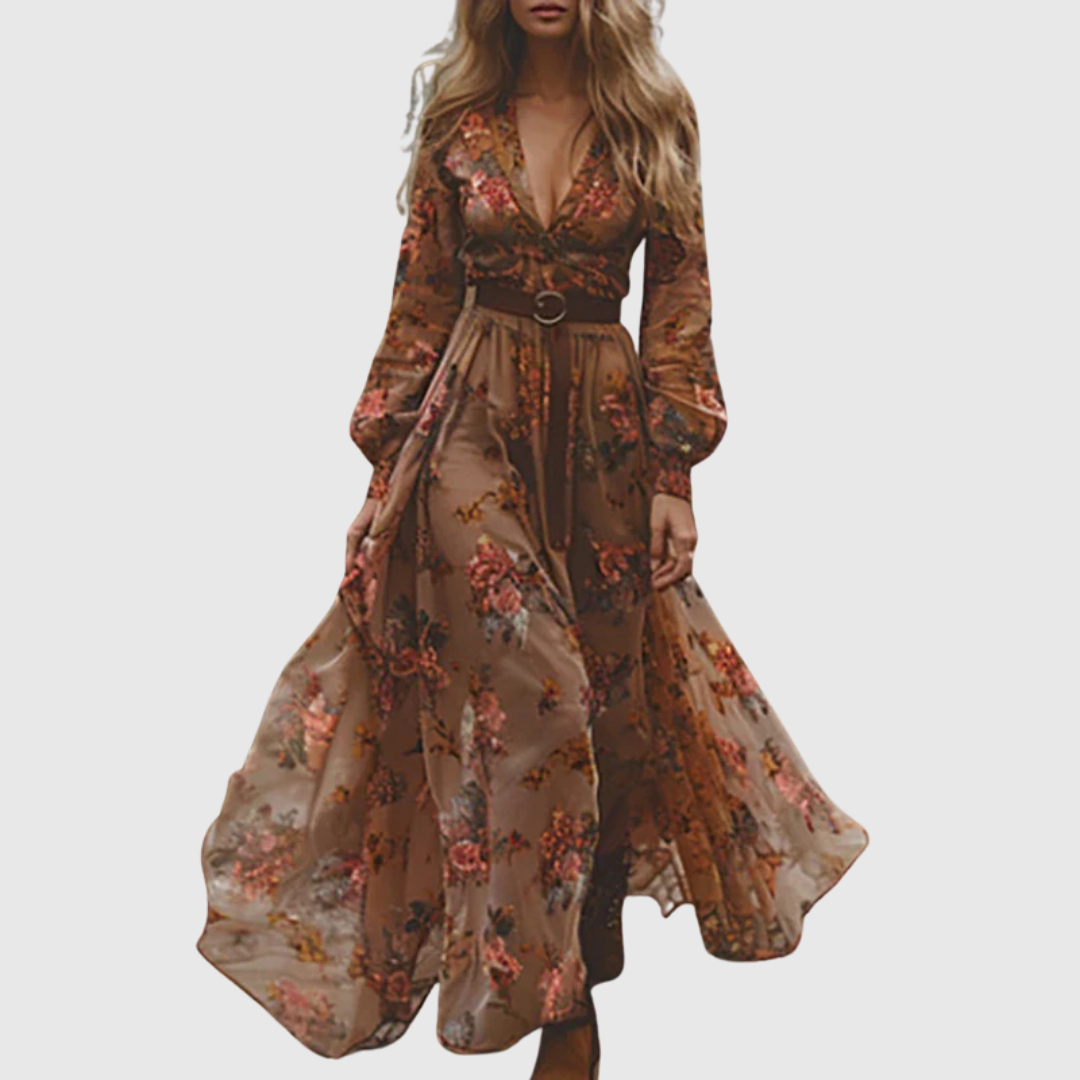 Flowy bohemian long dress for women featuring intricate embroidery, sheer sleeves, and a stylish ruffle hem.