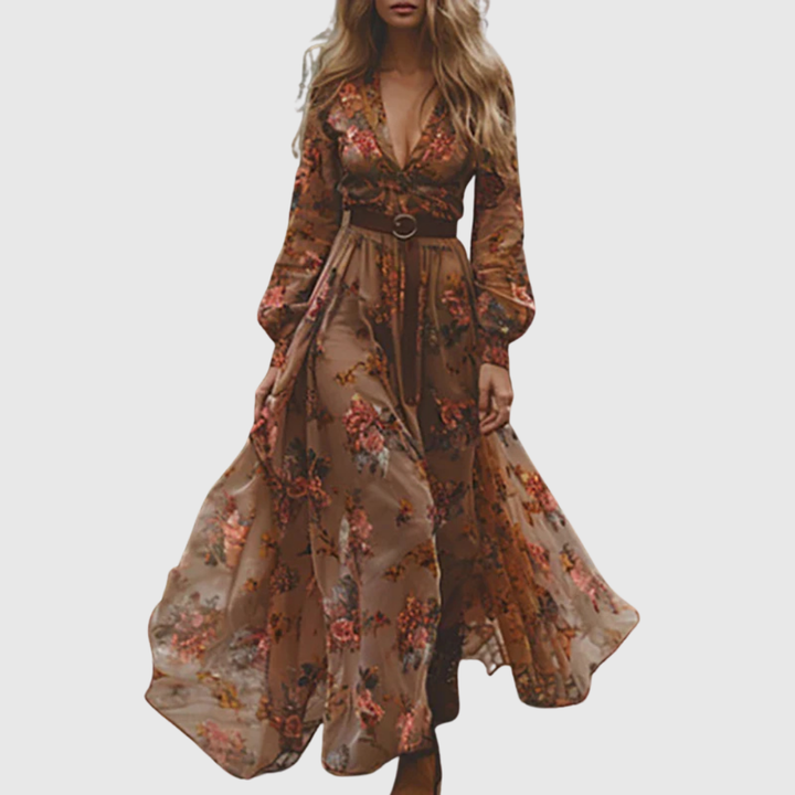 Flowy bohemian long dress for women featuring intricate embroidery, sheer sleeves, and a stylish ruffle hem.