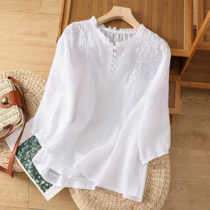 Women's embroidered boho tunic blouse with floral patterns, button-front style, perfect for summer casual wear.