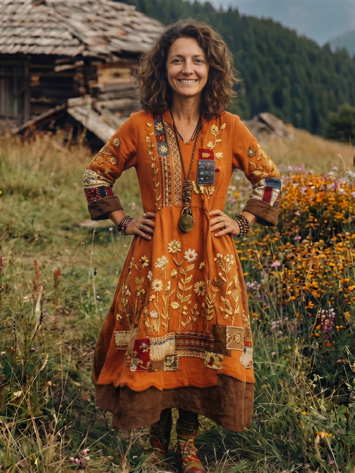Distinct panel design on a women's embroidered long sleeve midi dress, showcasing unique patterns.