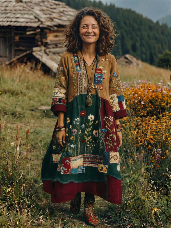 Midi length hemline of a women's embroidered panel dress. Flowing style, modest fashion appeal.