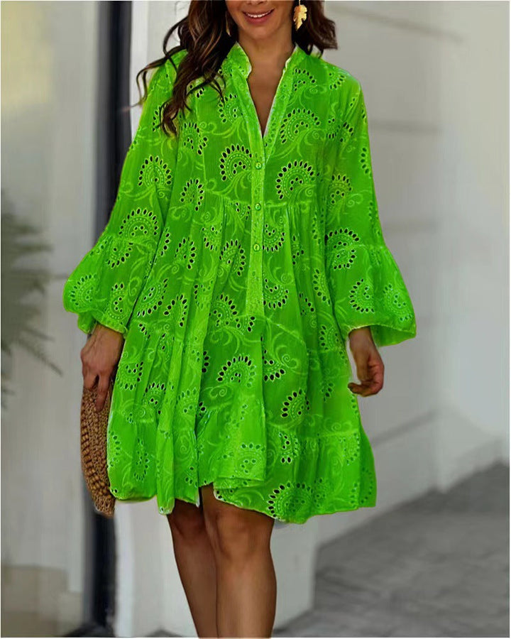 Comfortable flowy mini dress for women, featuring a tiered design, beautiful embroidery, and chic bell sleeves. Summer style.