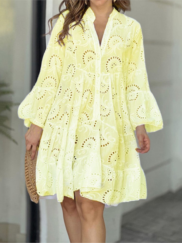 Stylish women's embroidered tiered mini dress, complete with bell sleeves, V-neck, and button front detail. Perfect summer.