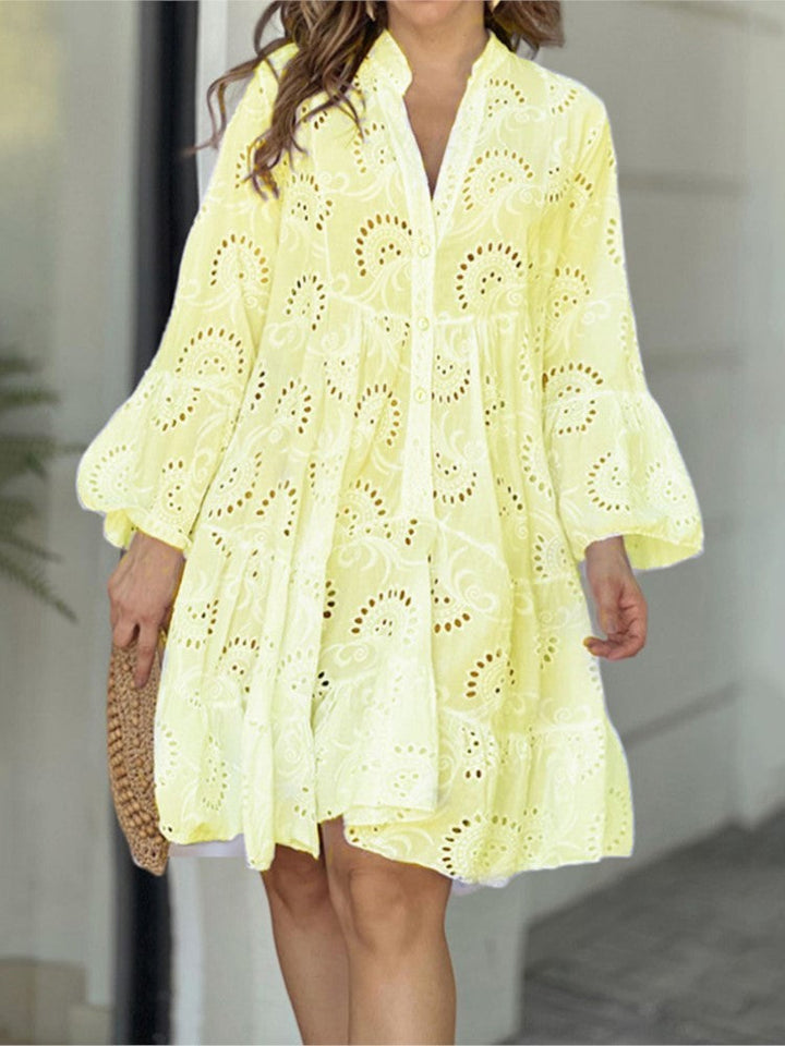 Stylish women's embroidered tiered mini dress, complete with bell sleeves, V-neck, and button front detail. Perfect summer.