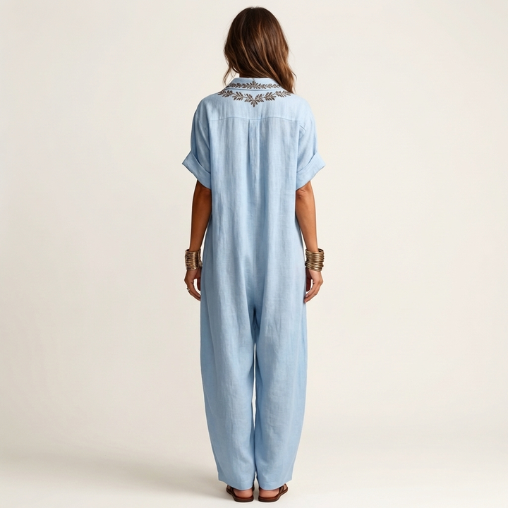 Elegant women's embroidered V-neck maxi dress, relaxed fit, floral, flowy, ideal for summer vacation & beachwear.