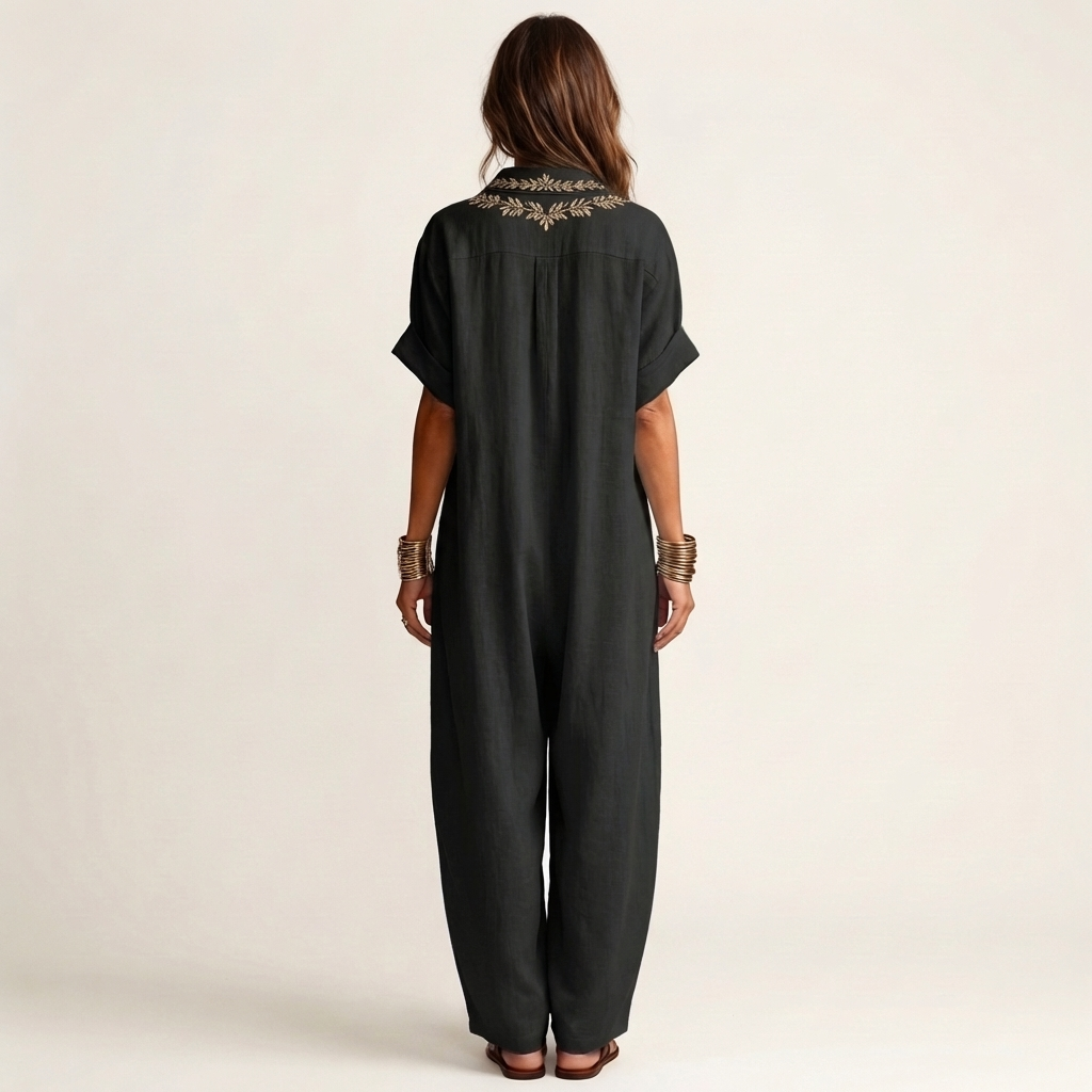 Chic women's embroidered V-neck maxi dress, long and flowy, ideal for an elegant summer or beach holiday.