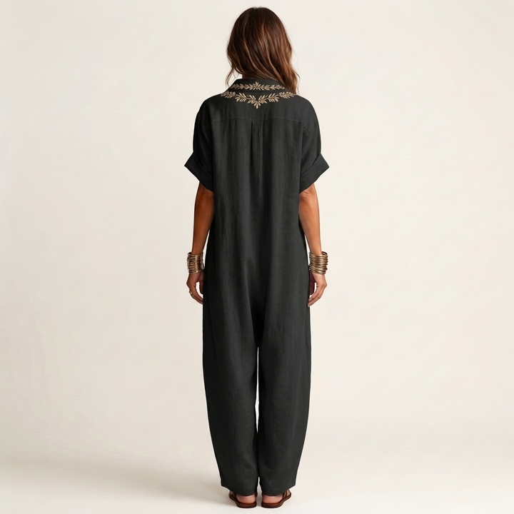 Chic women's embroidered V-neck maxi dress, long and flowy, ideal for an elegant summer or beach holiday.
