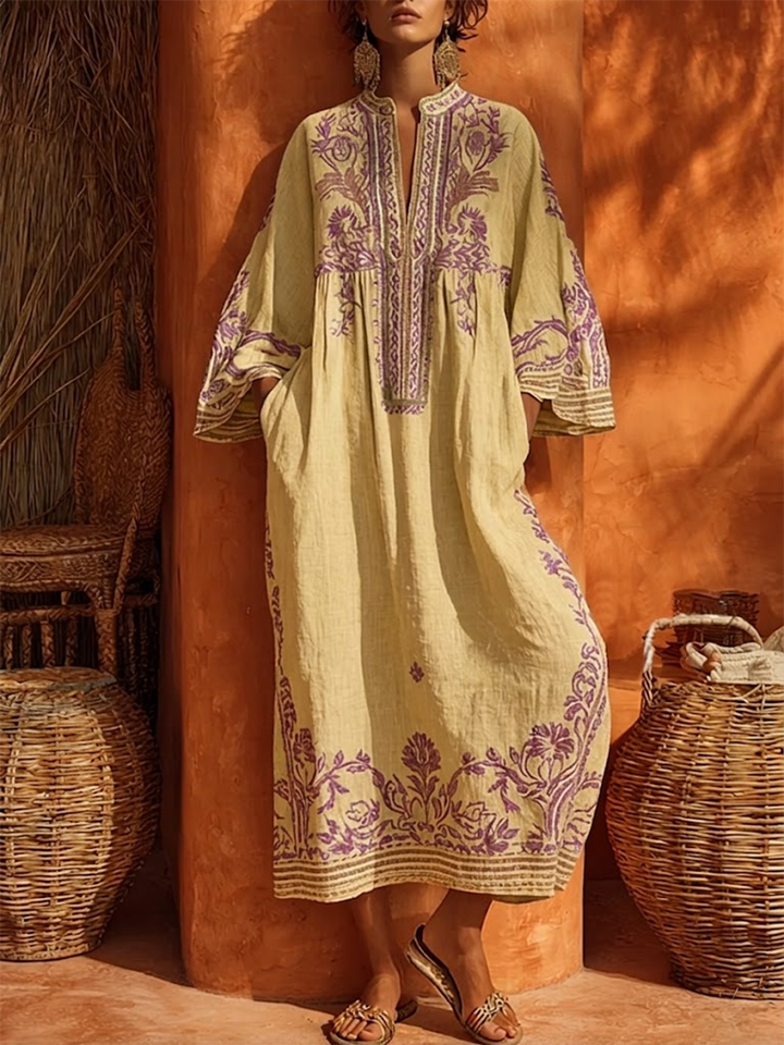 Women's embroidered V-neck maxi dress with bell sleeves. Elegant, flowy, and comfortable for summer events & vacation.