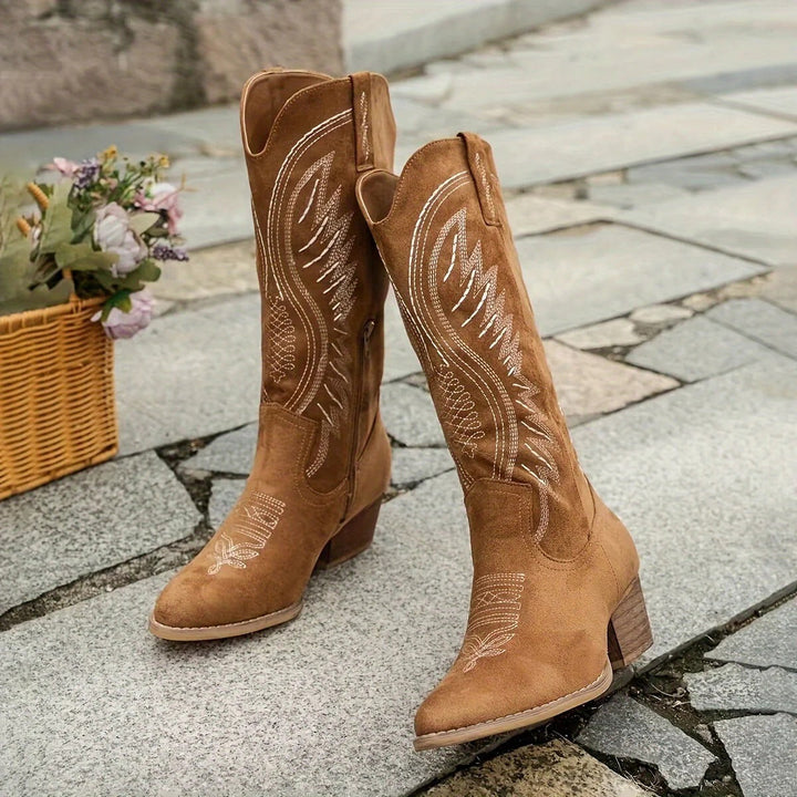 White embroidered mid-calf western boots for women, designed with a stable block heel. Chic cowgirl fashion.