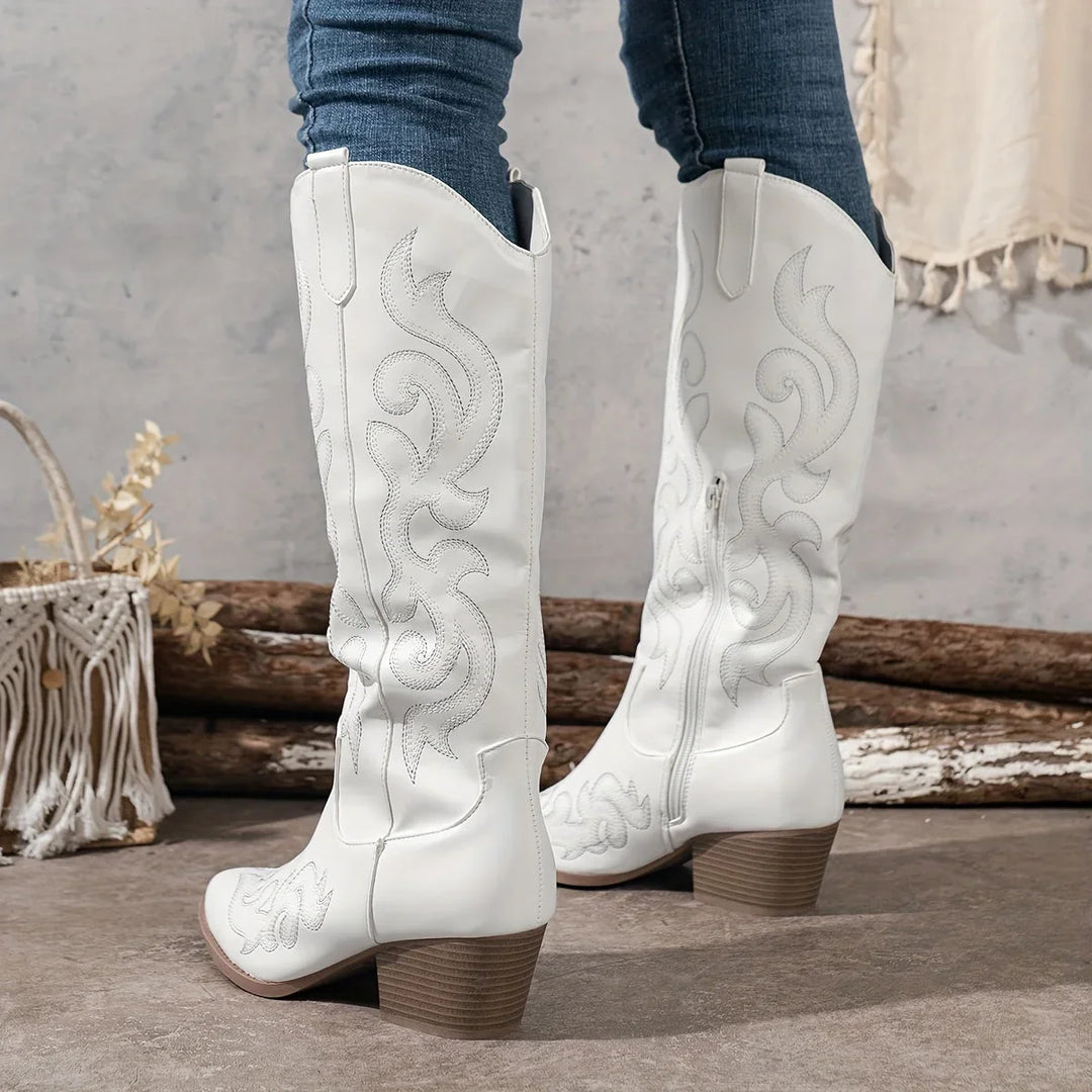 Women's embroidered western knee-high boots with sturdy block heel and convenient side zipper.