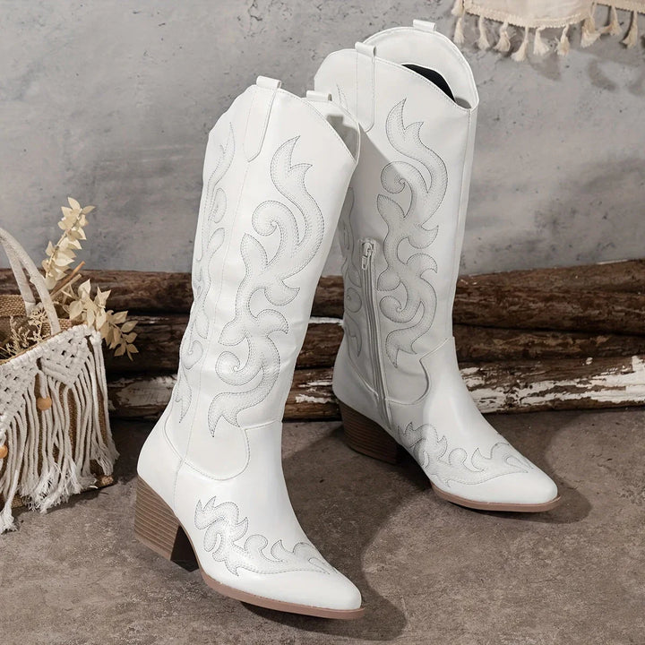Elegant women's western knee-high boots, embroidered detailing, and a comfortable block heel.