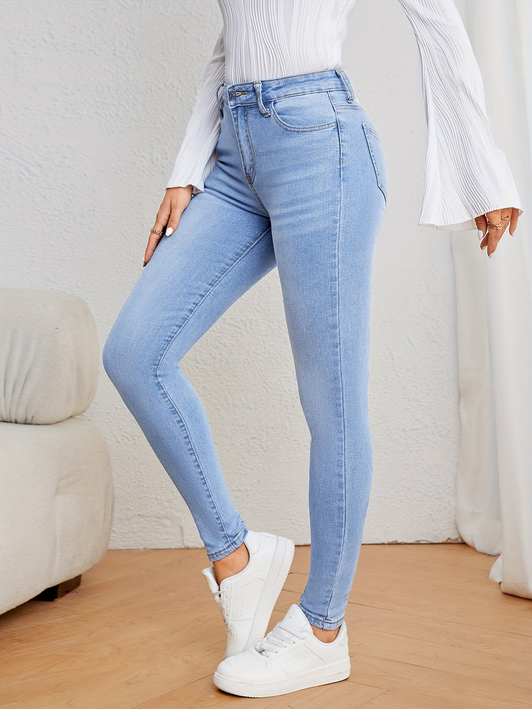 Woman wearing versatile Emma skinny jeans, pairing comfort with a stylish casual look.
