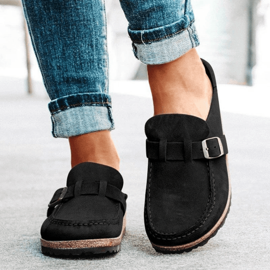 Slip-on women's shoes: comfortable ergonomic clogs featuring a supportive cork sole.