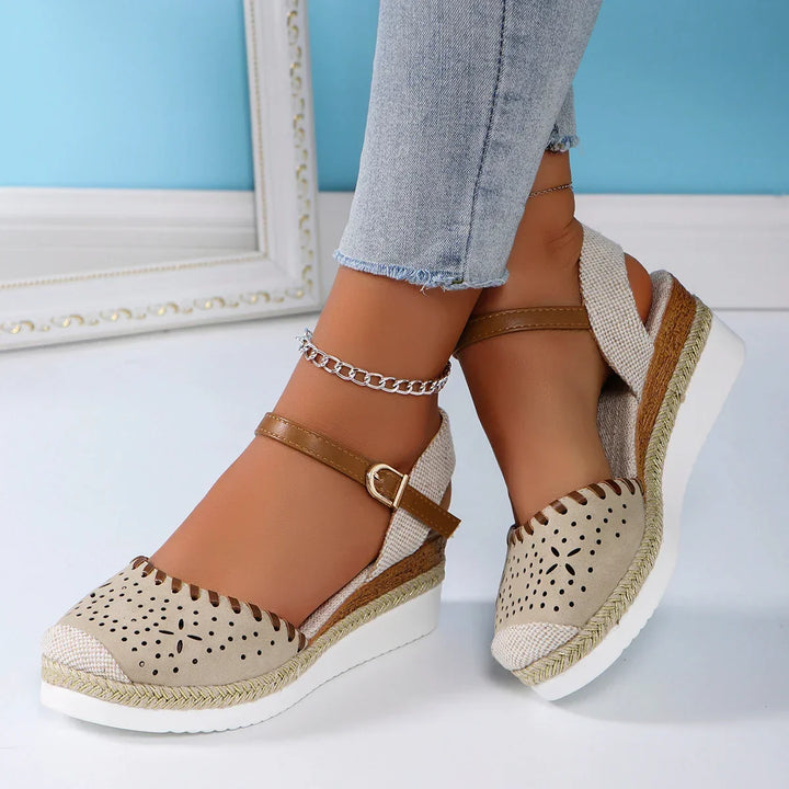 Comfortable women's espadrille wedge sandals with secure ankle strap, perfect for warm weather style.