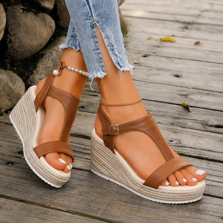 Comfortable women's espadrille wedge T-strap sandals featuring a secure buckle, perfect for all-day wear.