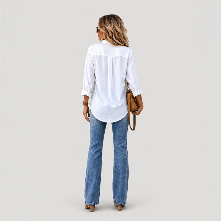Chic women's long-sleeve button-up blouse. Versatile for office or casual fashion, offering comfortable daily wear.