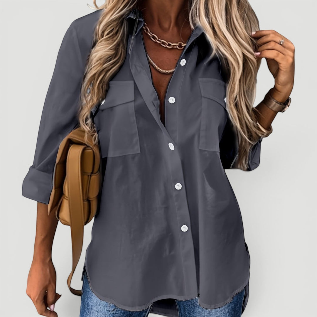 Woman wearing a comfortable long-sleeve button-up blouse. Ideal for everyday office & casual chic style.