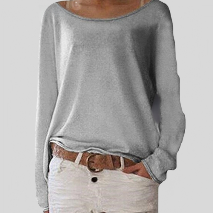 Model wearing a versatile women's fine knit round neck sweater, styled for effortless everyday fashion.