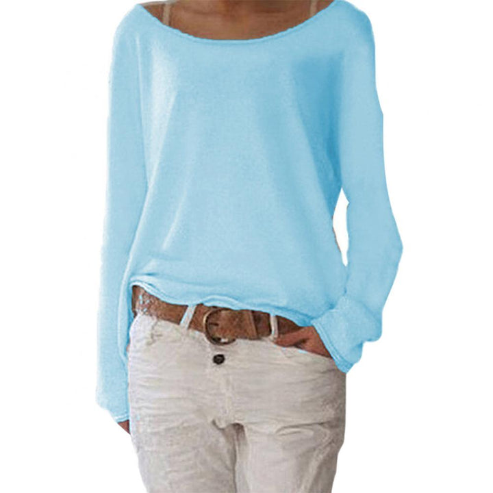 Stylish women's round neck sweater in a soft beige, showcasing its versatile fine knit design.