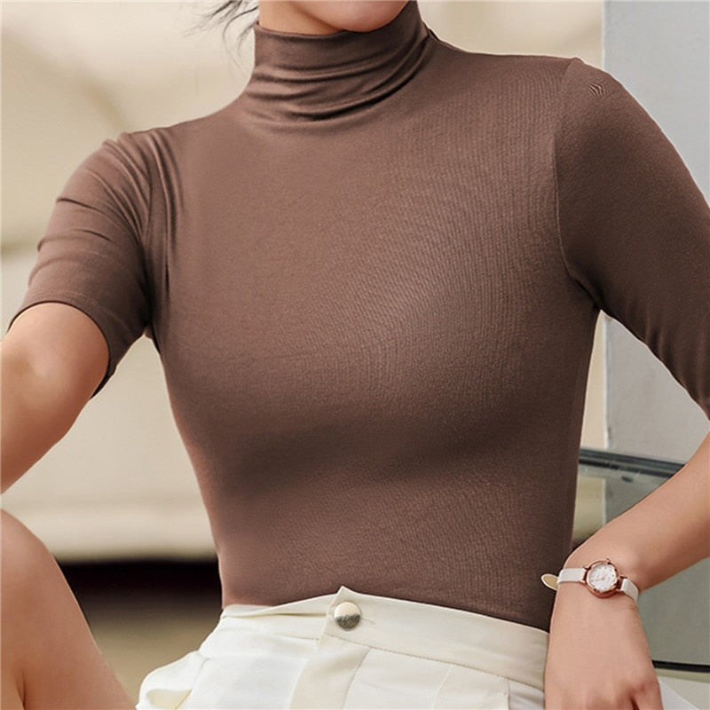 Fashionable women's elbow sleeve turtleneck, a fitted top for women. Ideal for layering & elegant styling.