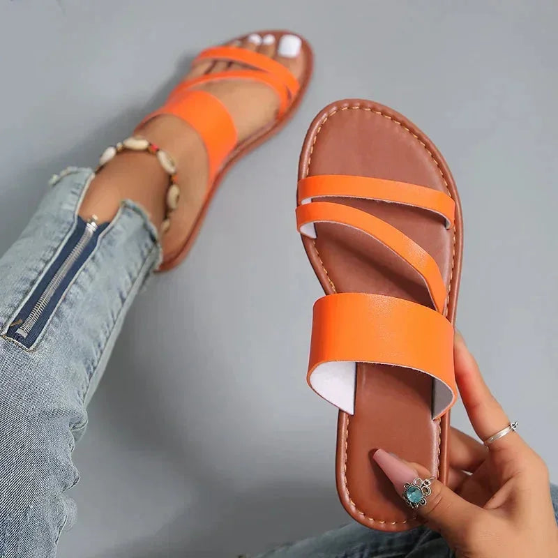 Versatile women's flat slip-on sandals, cushioned multi-strap and open-toe for maximum summer comfort.