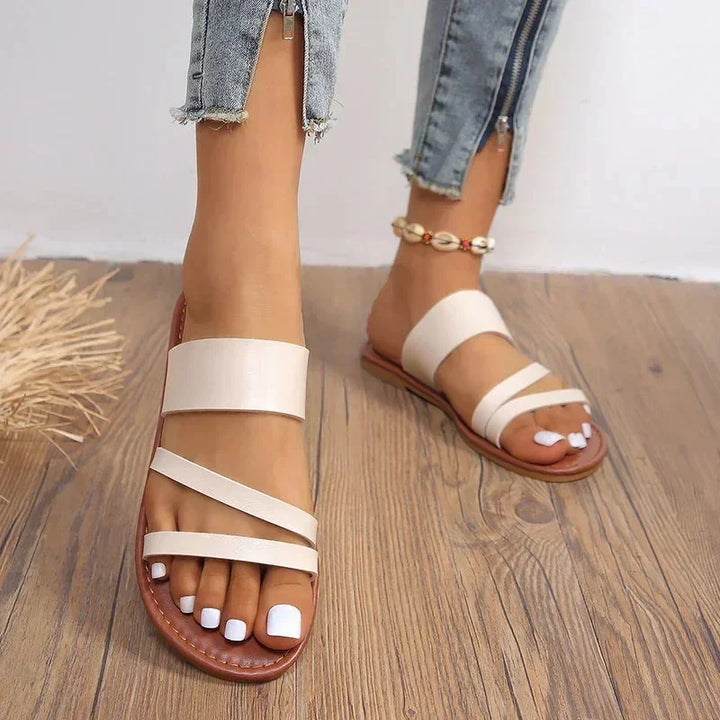 Chic women's multi-strap flat sandals, open-toe slip-on for casual summer comfort & everyday wear.