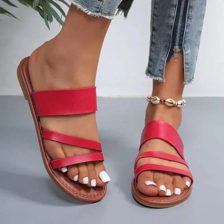 Versatile women's flat cushioned multi-strap sandals, open-toe slip-on style for beach & casual summer.