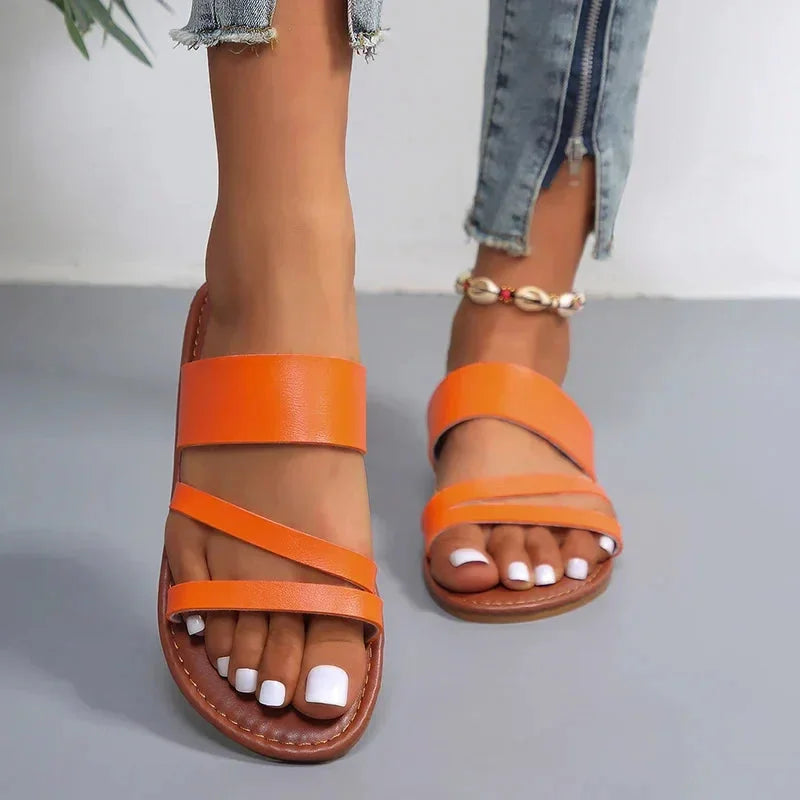 Summer women's flat multi-strap sandals, cushioned open-toe slip-on for beach days & casual comfort.
