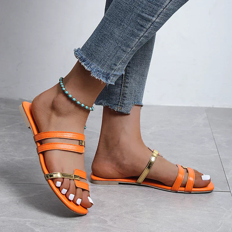 Women's flat slides with double strap & stylish gold detail. Perfect open-toe summer sandals.