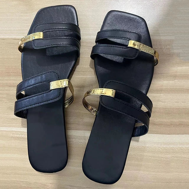 Stylish women's open-toe slides with comfortable flat sole, double straps & metallic gold detail.