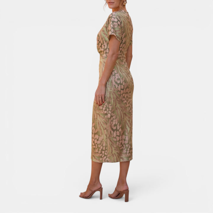 Elegant apricot midi dress for women, designed with a flattering defined waist for a chic look.
