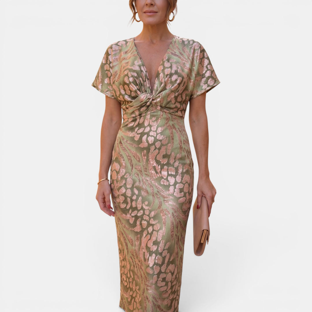 Apricot women's midi dress with a unique twist defined waist, an elegant and flattering summer option.