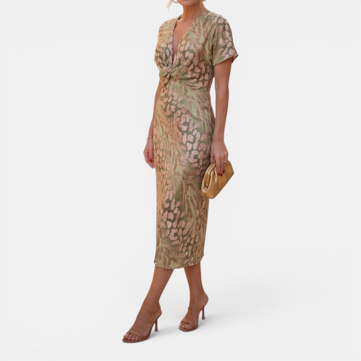 Chic women's occasion wear midi dress in apricot, with a flattering defined waist and elegant style.