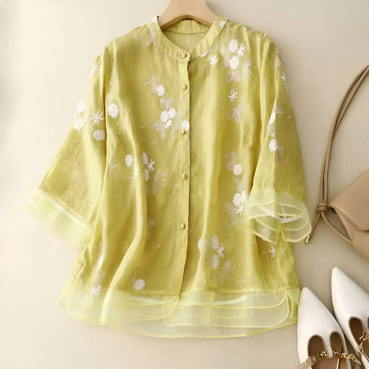 Green women's embroidered top, a versatile piece with a flattering fit for casual and elegant summer outfits.