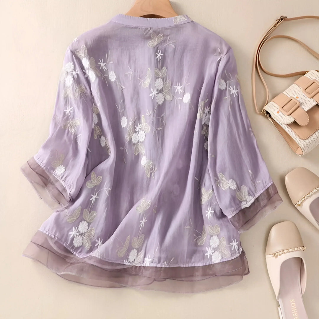Elegant cream embroidered top for women. Flattering fit, perfect for casual spring and summer fashion.