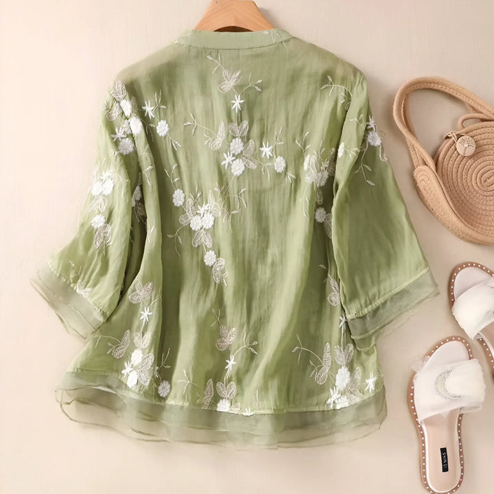 Casual green embroidered women's top with a flattering tummy skimming design. Ideal for summer style.
