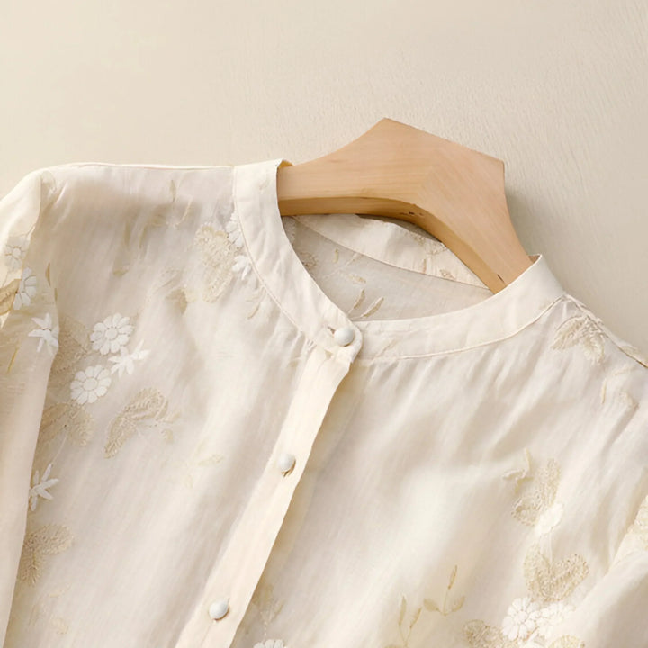 Purple embroidered women's blouse, a flattering tummy skimming top for effortless everyday spring fashion.
