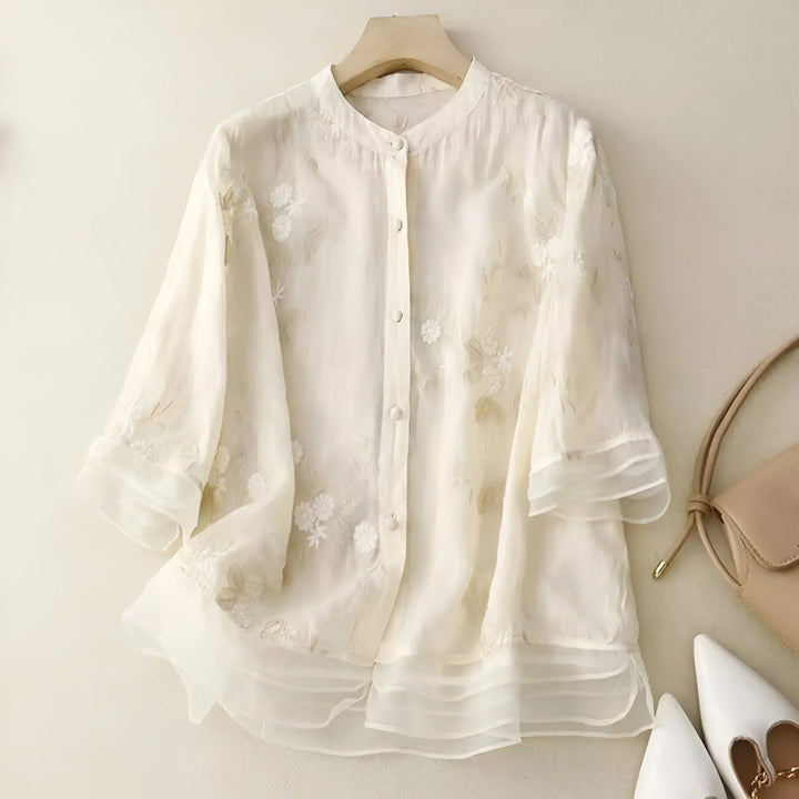 Yellow embroidered women's top, offering a flattering fit and tummy skimming design for summer casual wear.