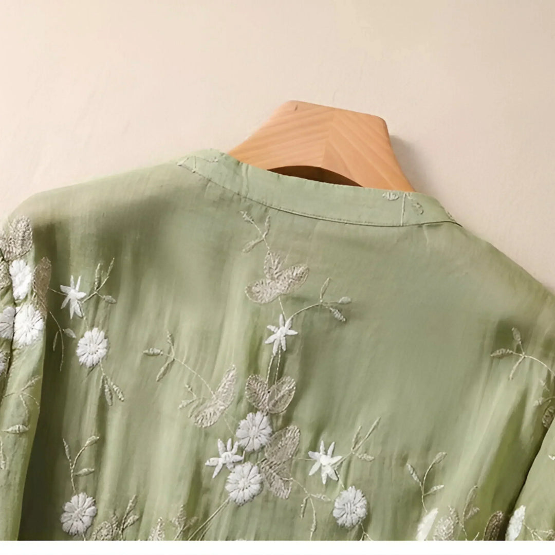 Embroidered casual top for women. Elegant design, flattering fit, and tummy skimming for comfortable everyday wear.