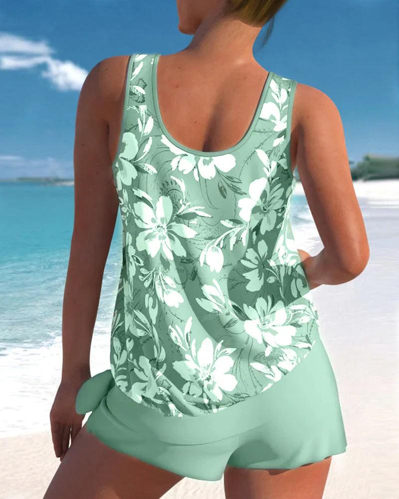 Modest women's tankini swimsuit set. V-neck top with adjustable straps & comfortable boyshorts. Ideal summer resort wear.