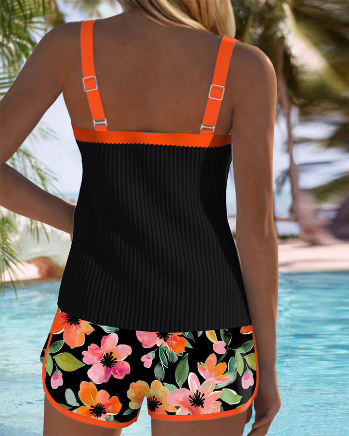 Two-piece women's tankini with tummy control, adjustable straps & modest coverage.