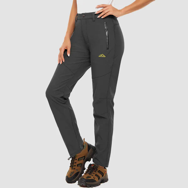 Women's fleece-lined waterproof trousers offering comfort and protection in all weather.