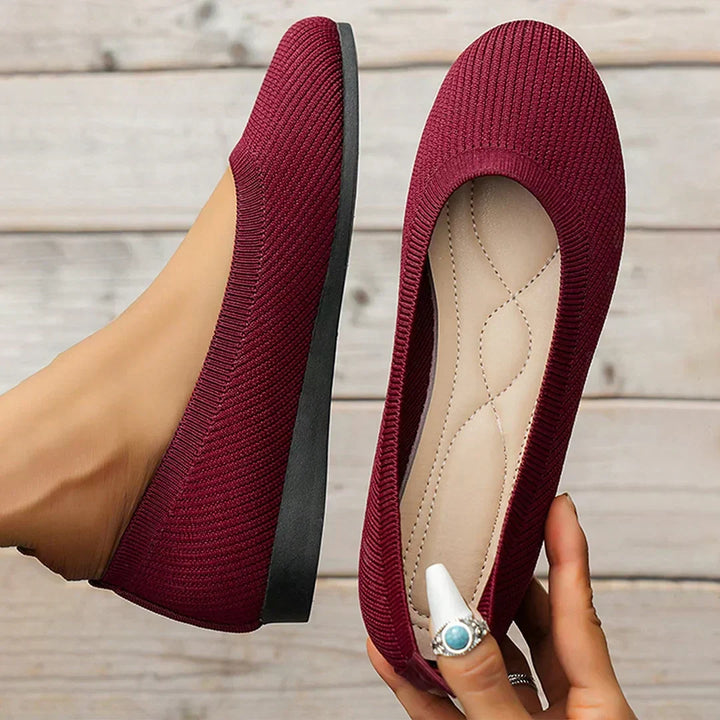 Detailed view of the non-slip sole on women's flexible knit work flats.