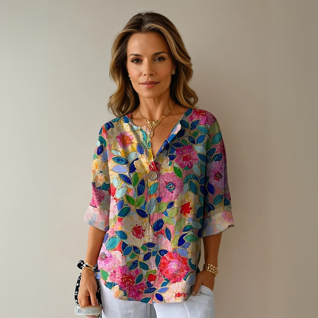 Women's floral 3/4 sleeve blouse, comfortable and chic for spring/summer casual wear.