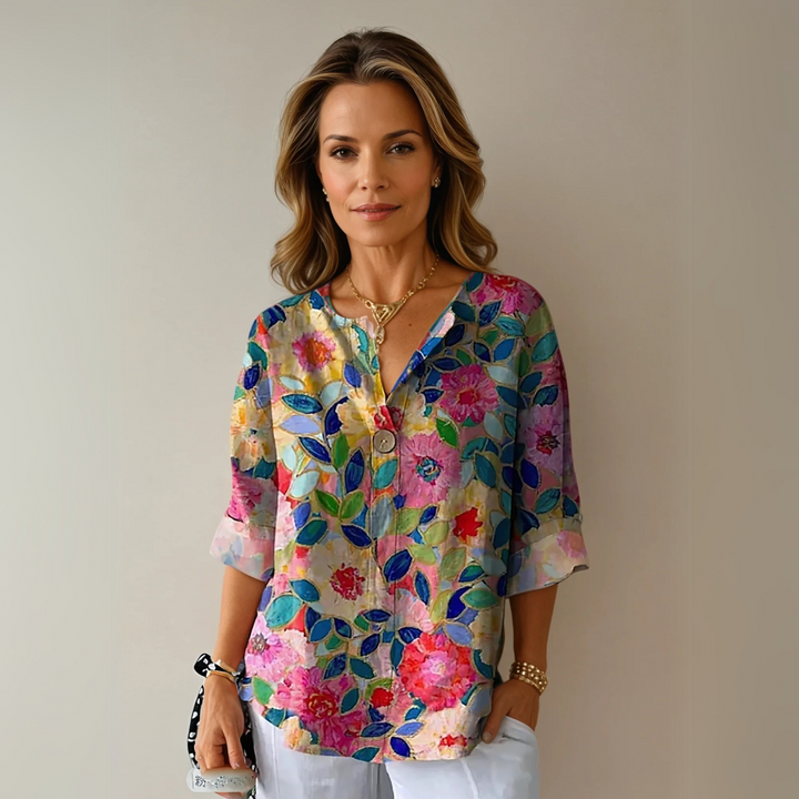 Women's floral 3/4 sleeve blouse, comfortable and chic for spring/summer casual wear.