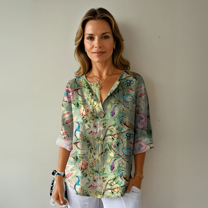 Chic button-down floral 3/4 sleeve blouse for women, versatile and comfortable everyday style.