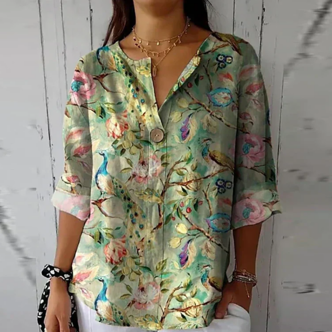 Versatile women's floral 3/4 sleeve top, comfortable & chic for spring/summer casual or elegant wear.