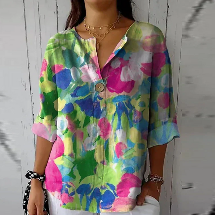 Women's comfortable floral 3/4 sleeve button-down blouse, perfect for chic spring/summer styling.