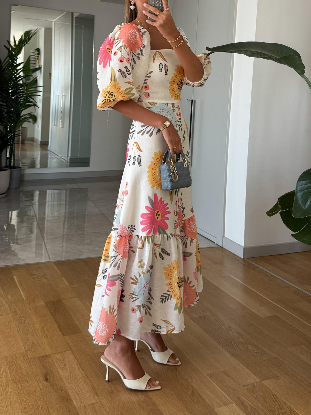 Stylish puff sleeve midi dress in a delightful floral print, a must-have for spring fashion.
