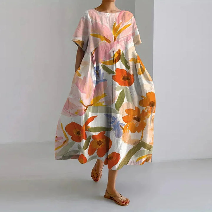 Women's floral A-line midi dress with round neck & short sleeves, perfect for summer casual or vacation wear.